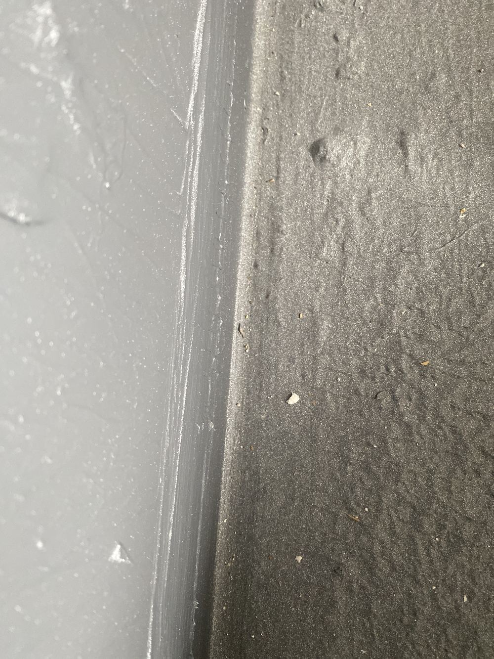 Shower wall junction with no bond breaker under a flexible membrane, found during a waterproofing inspection in Carlingford