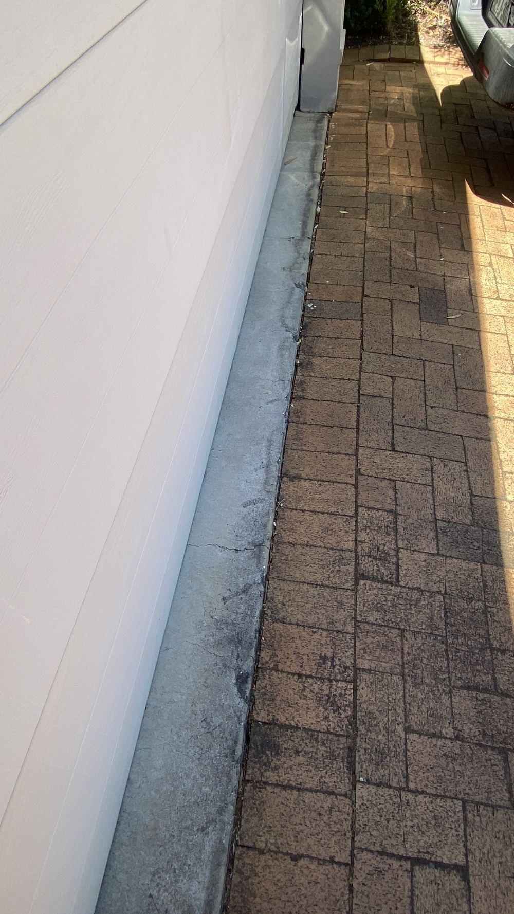 Moderate cracking in concrete paving where control joints were too few, Castle Hill