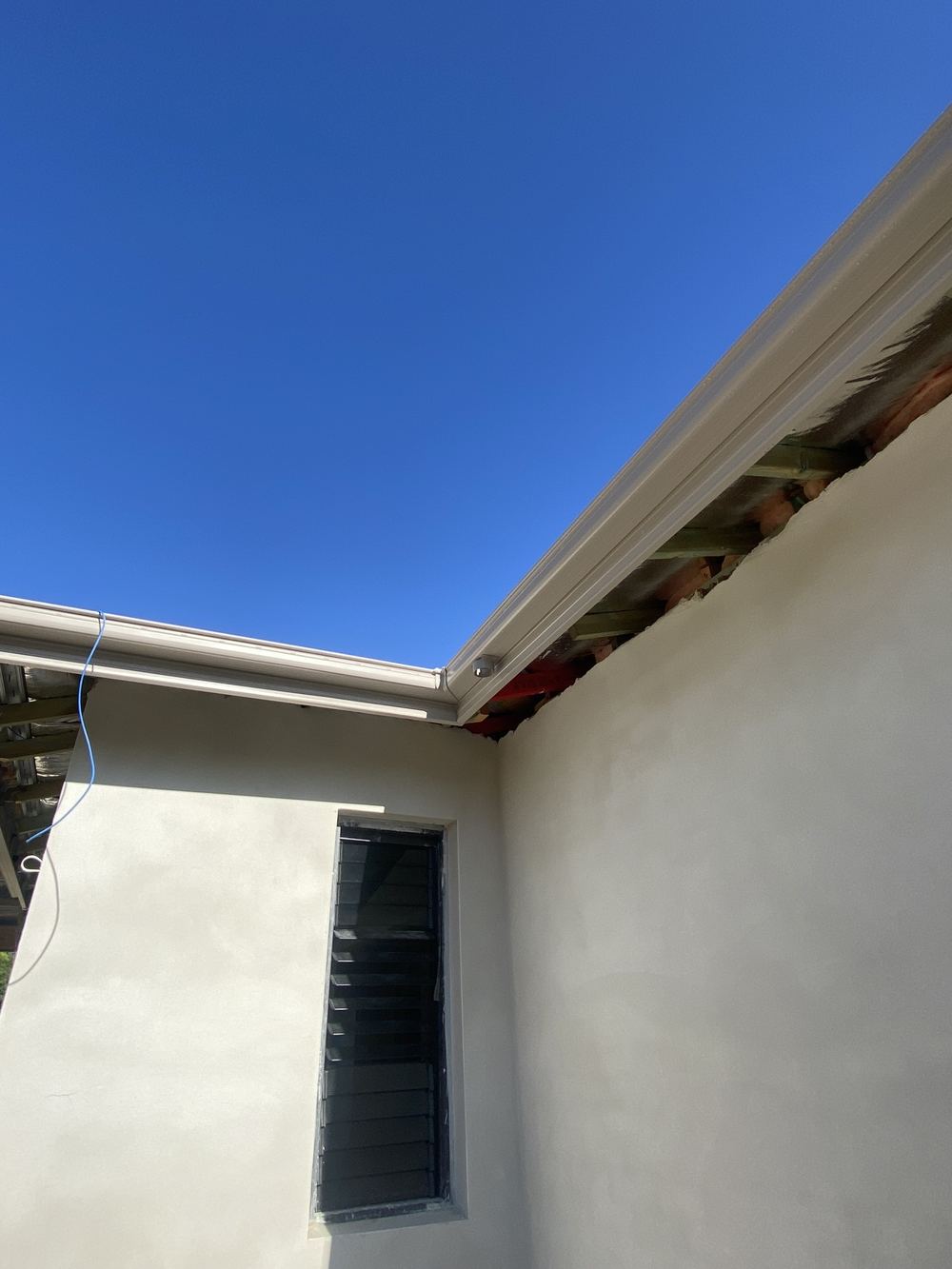 Ground floor downpipes not installed, leaving roof water to pond at the walls, Kellyville, Castle Hill