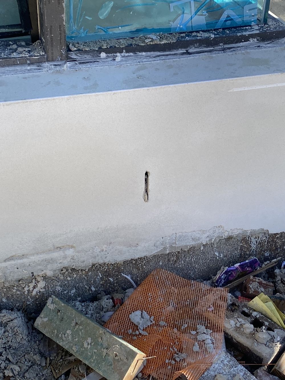 Weep holes blocked with mortar and render, found during a fixing stage inspection in Kellyville